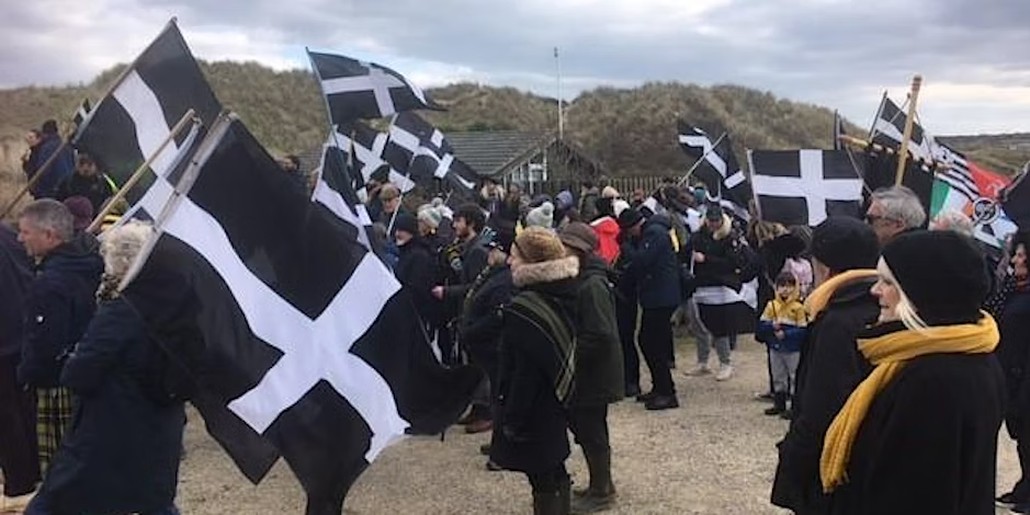 People carrying Cornish flags